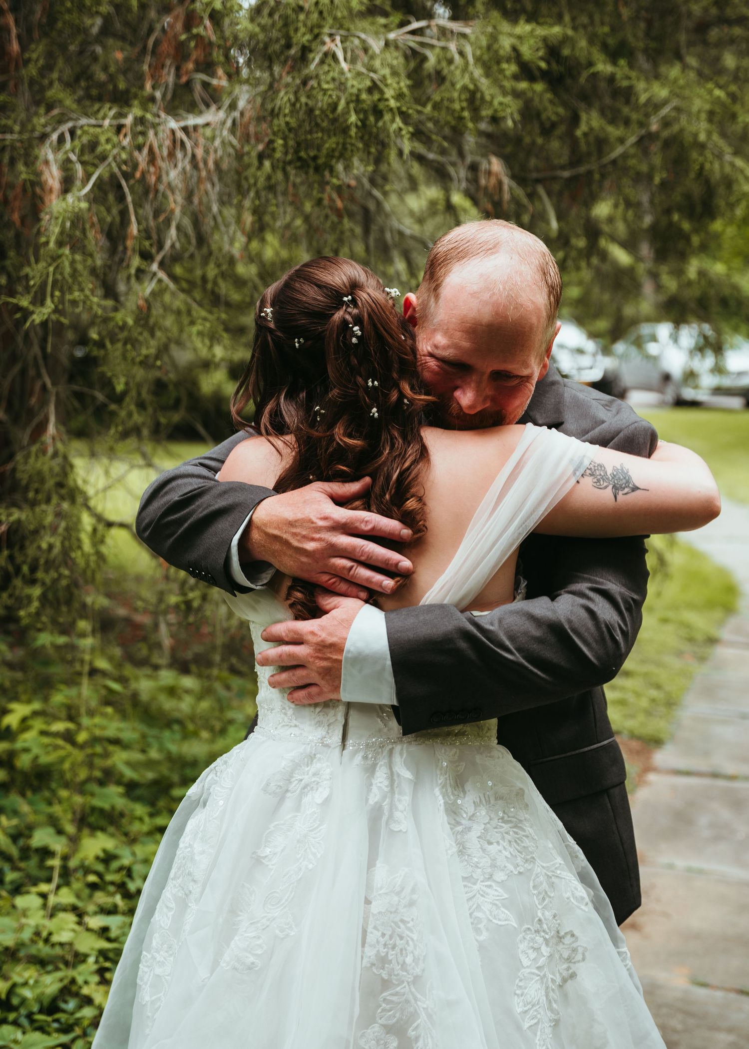 A series of intimate wedding photos showing a couple embracing outdoors in a garden setting.