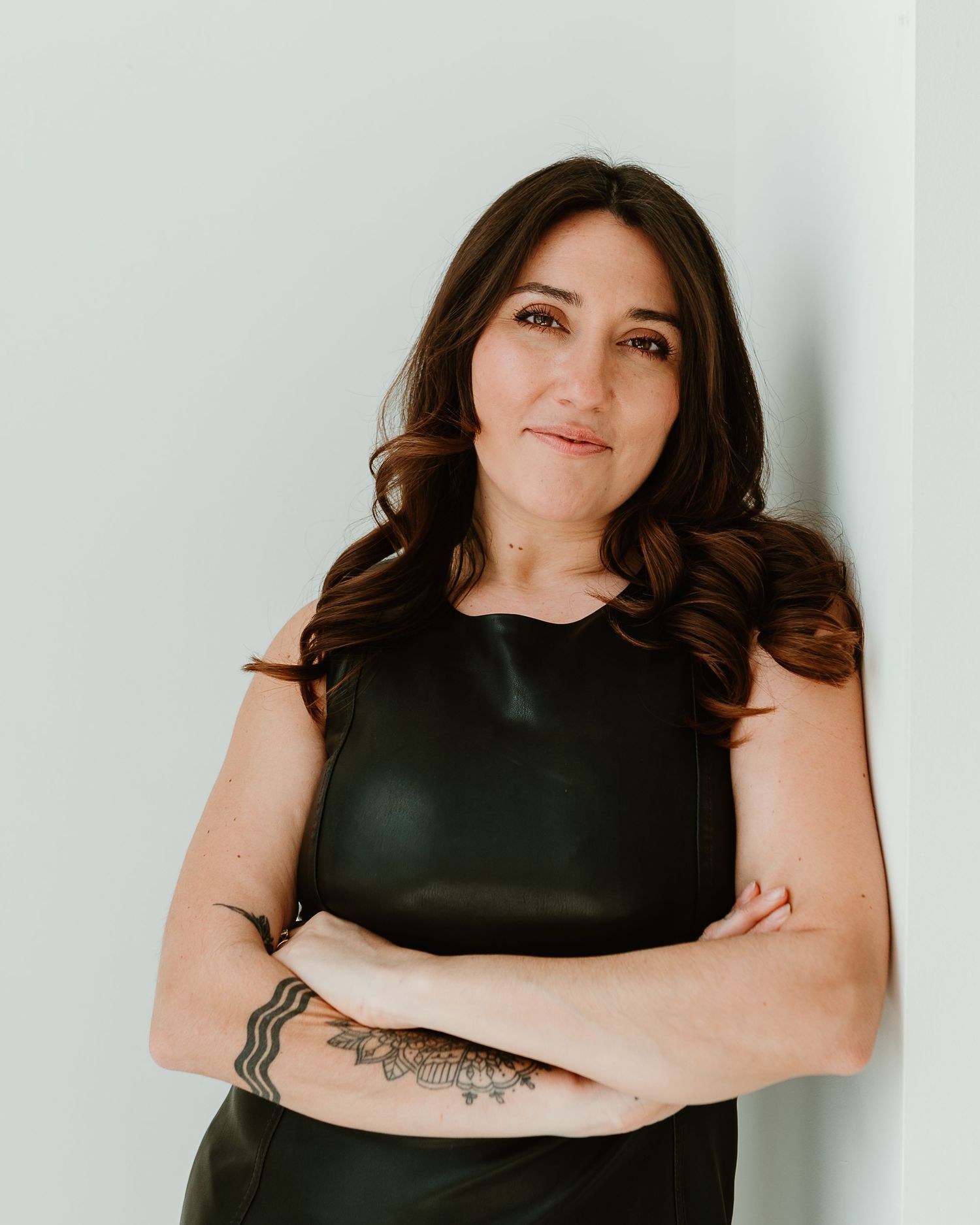 Professional studio portrait against white background.