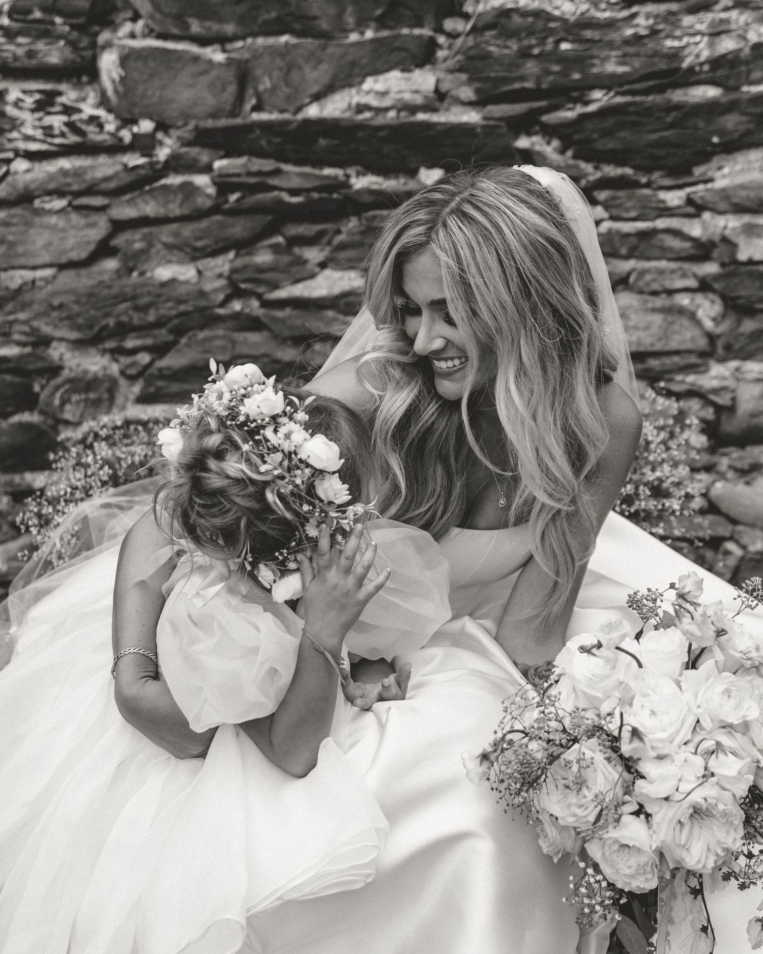 Black and white photo series of bridesmaids in white dresses with floral bouquets posing together.