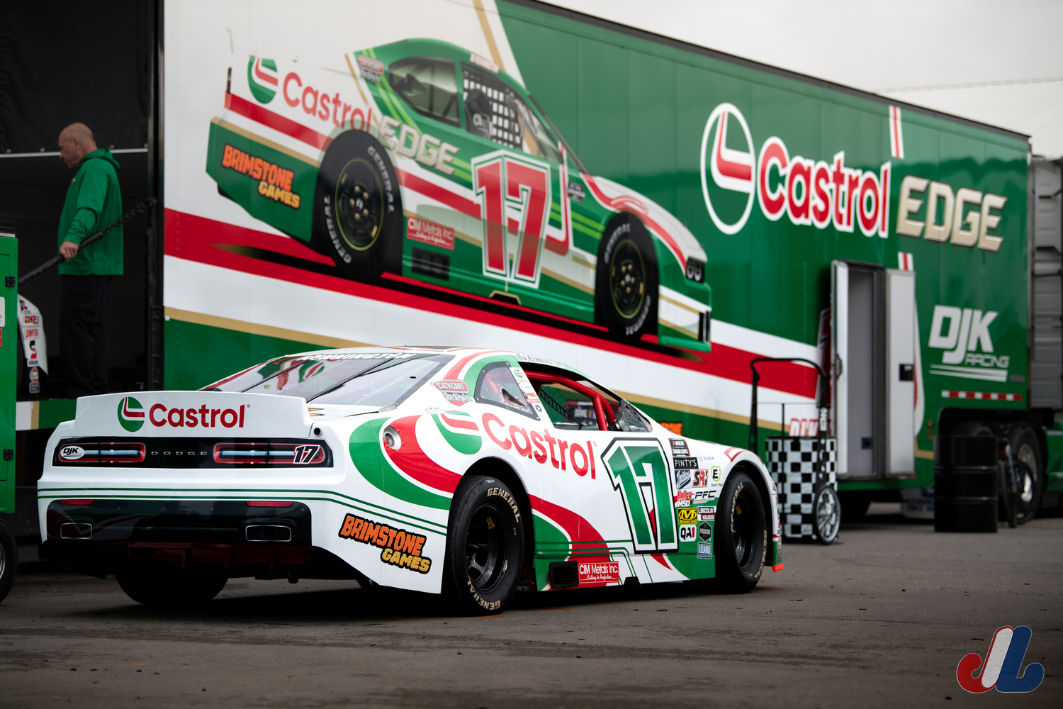 Racing cars with Castrol Edge branding lined up at a motorsport event.