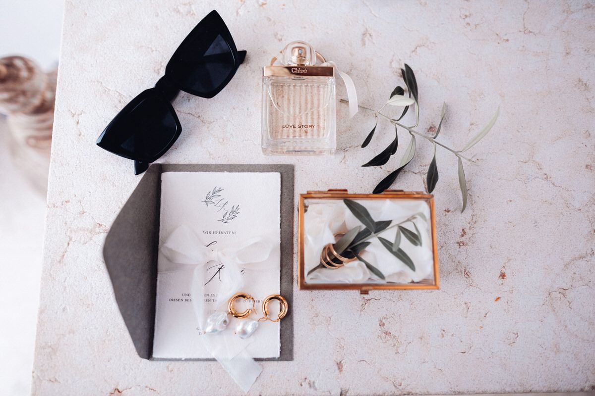 Wedding stationery and accessories arranged as a flatlay, modern and elegant design