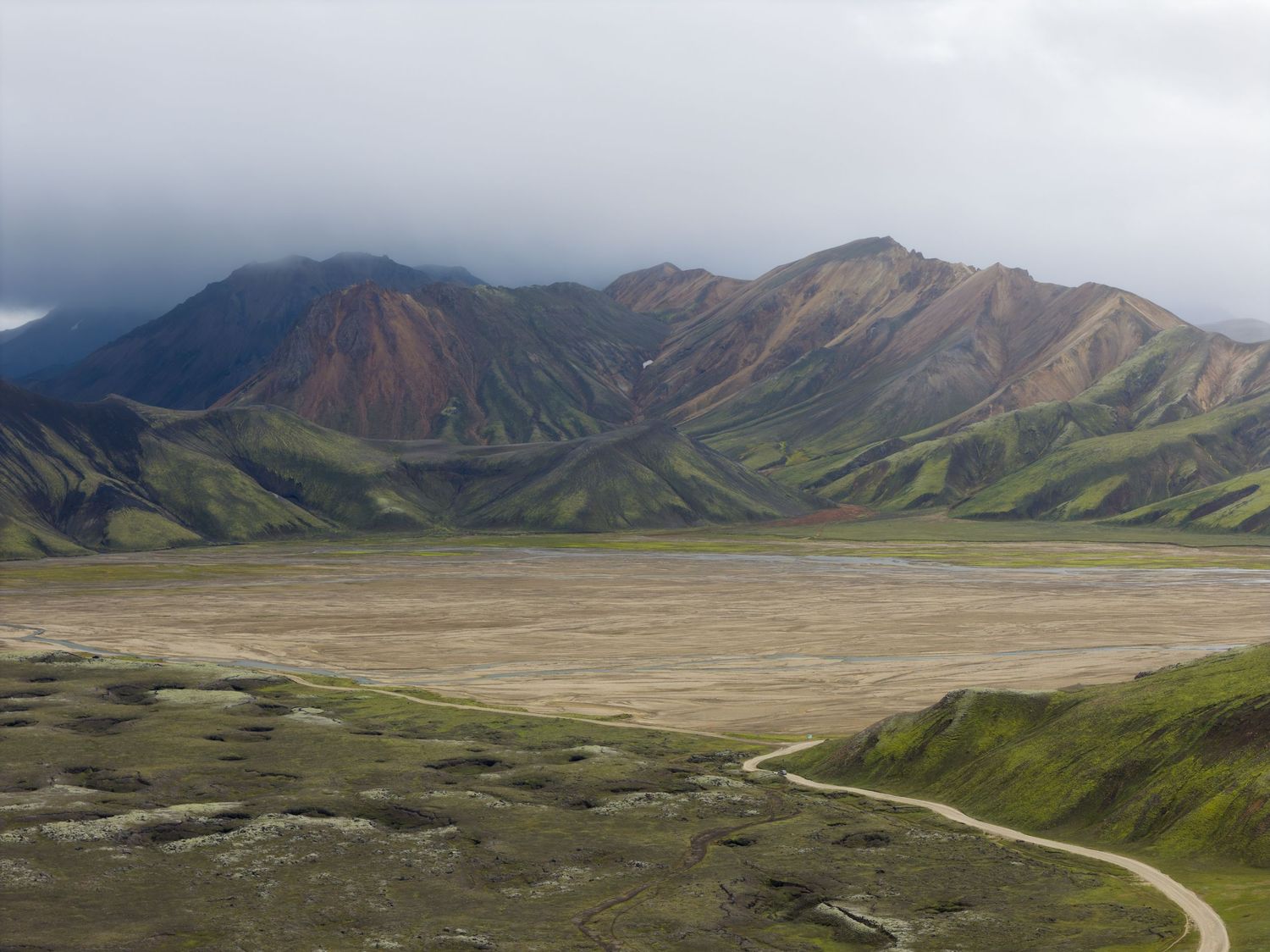 Panoramic vista of colorful mountains and valleys.