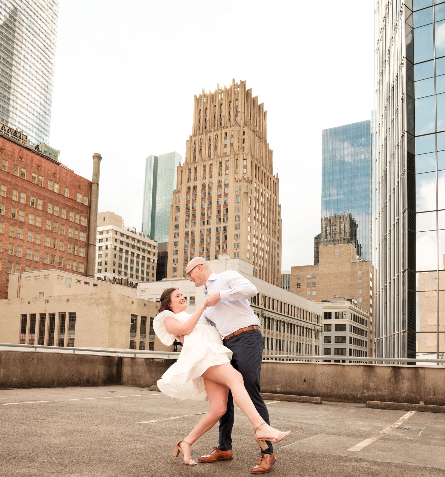 Couple shares a dance on the rooftop in Downtown, Houston, Tx
