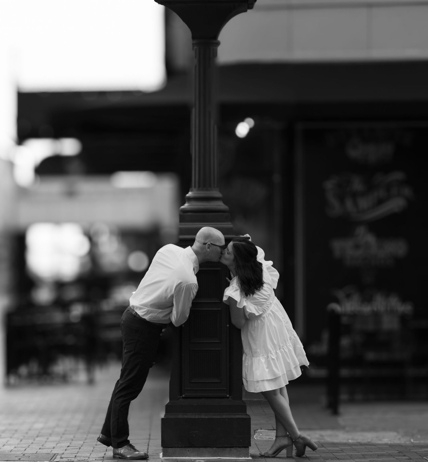 Couple shares a kiss on the streets of Downtown Houston, Tx