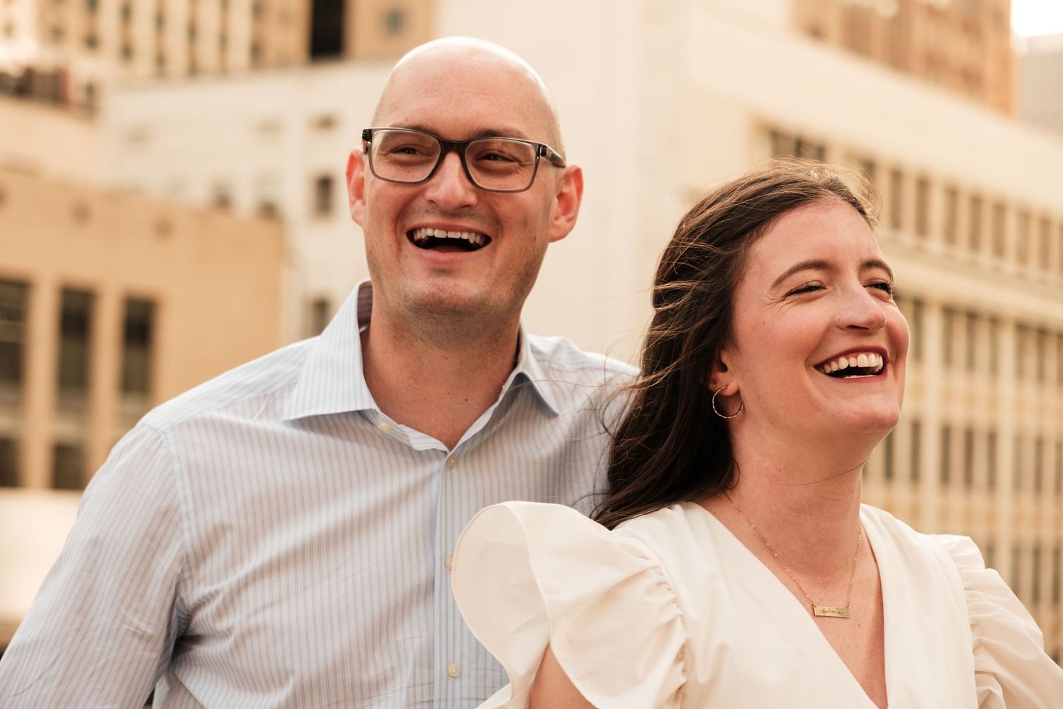 Engagement photos, couple shares a laugh, Houston Tx