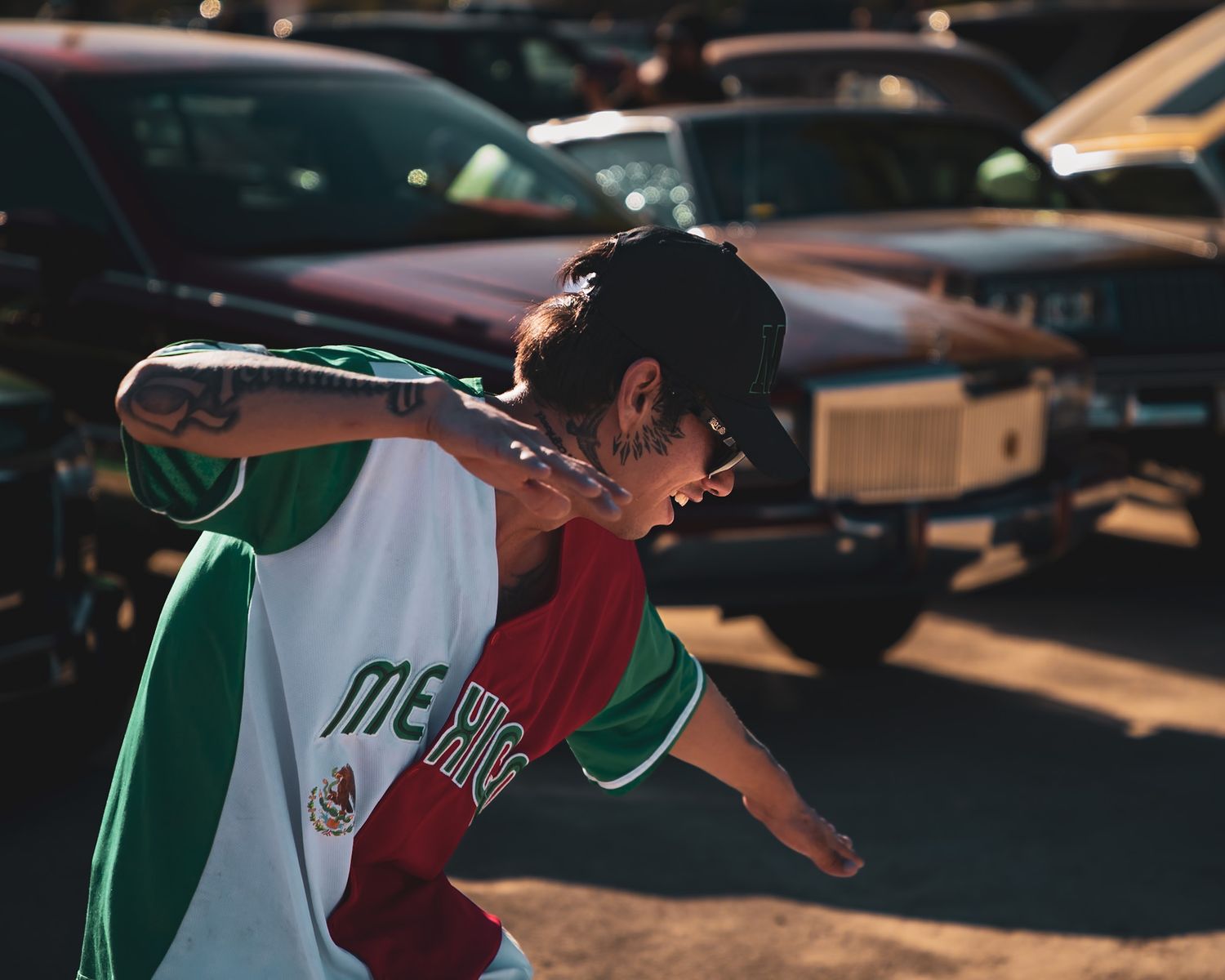 People waving Mexican flags at a nighttime gathering. Captured by a Seguin photographer at grain n glass
