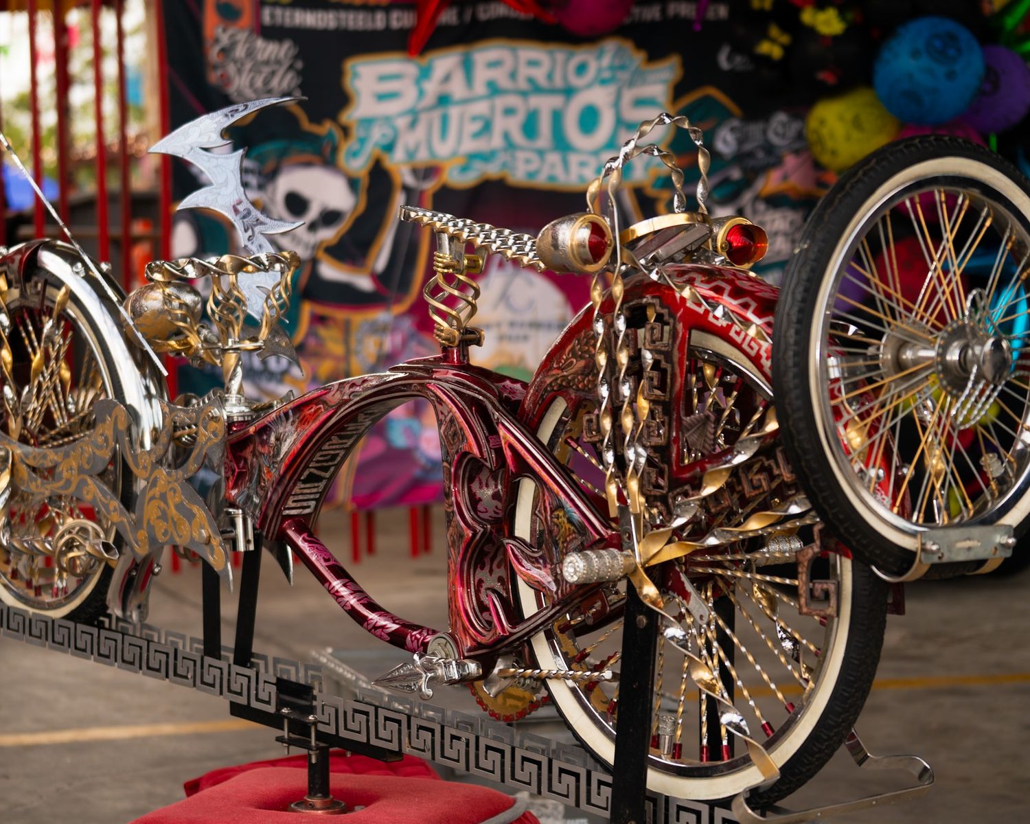 Row of custom lowrider bicycles displayed at an outdoor event. (Barrio muertos party) Captured by a Seguin photographer at grain n glass