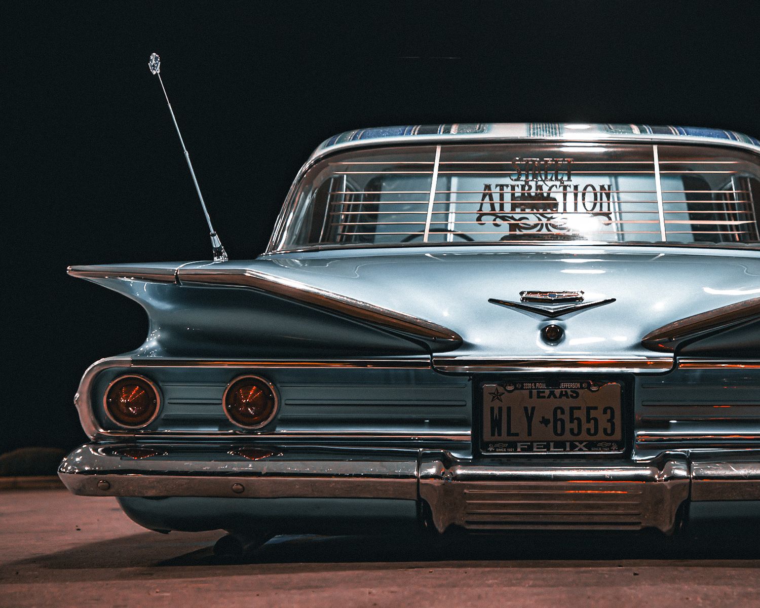 Classic vintage bel air rear view of  tail lights against dark background. Captured by a Seguin photographer at grain n glass