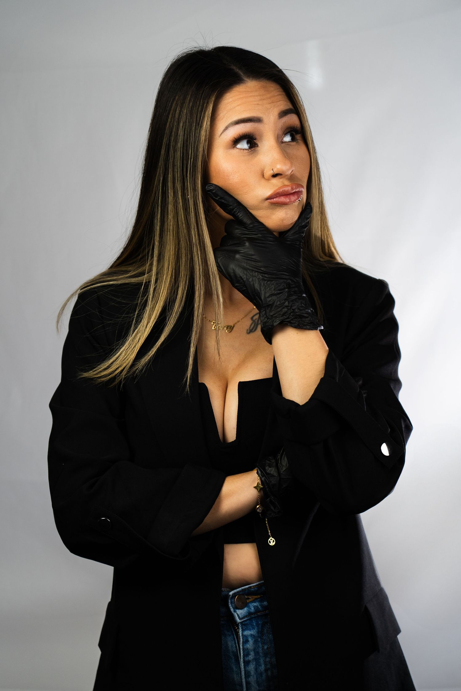 Fashion portrait with black blazer and gloves showing dynamic poses.