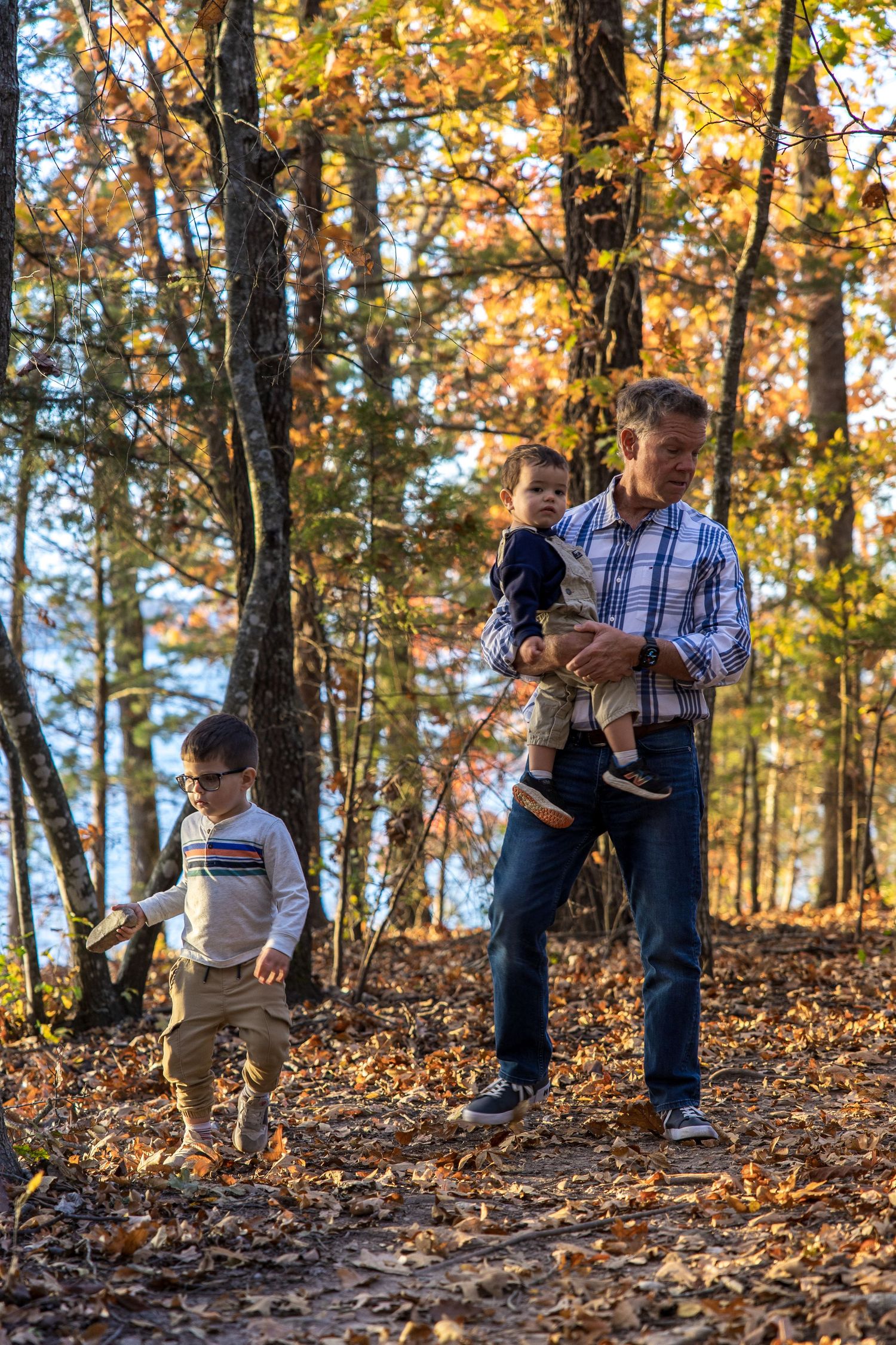 Grandparents with grandkids in the fall forest