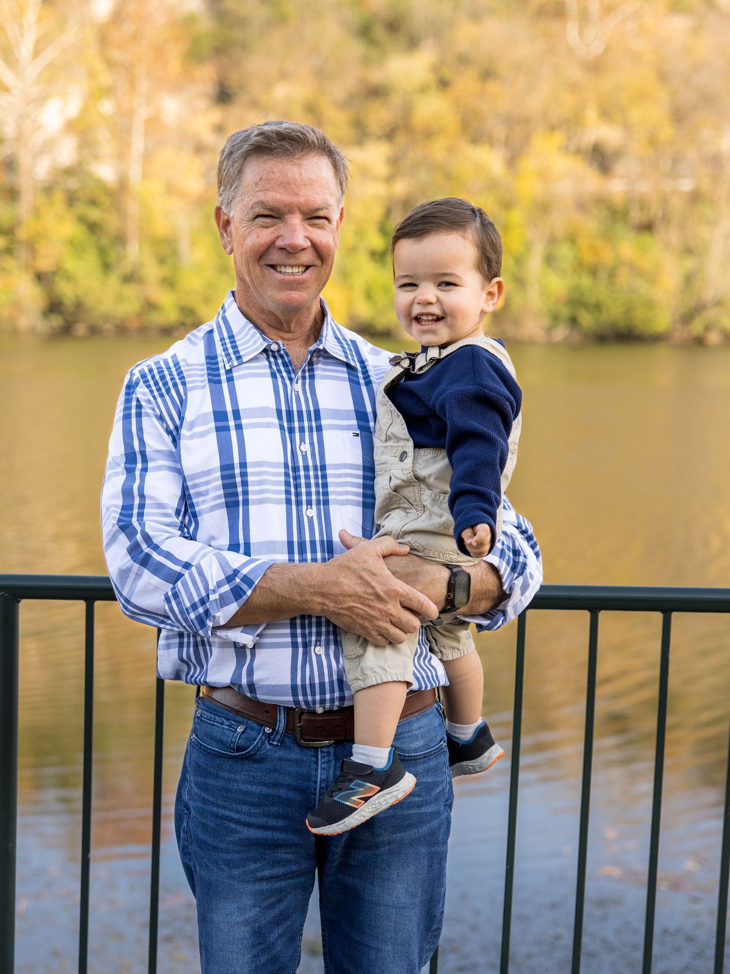 papa with 2 year old grandson and branson landing in the fall