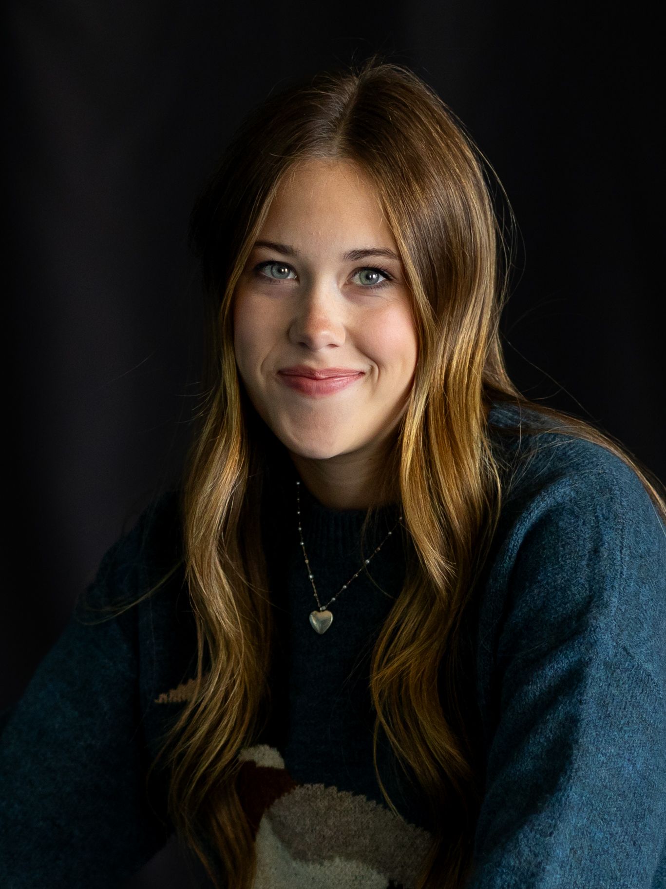 senior girl portrait close up with black back drop