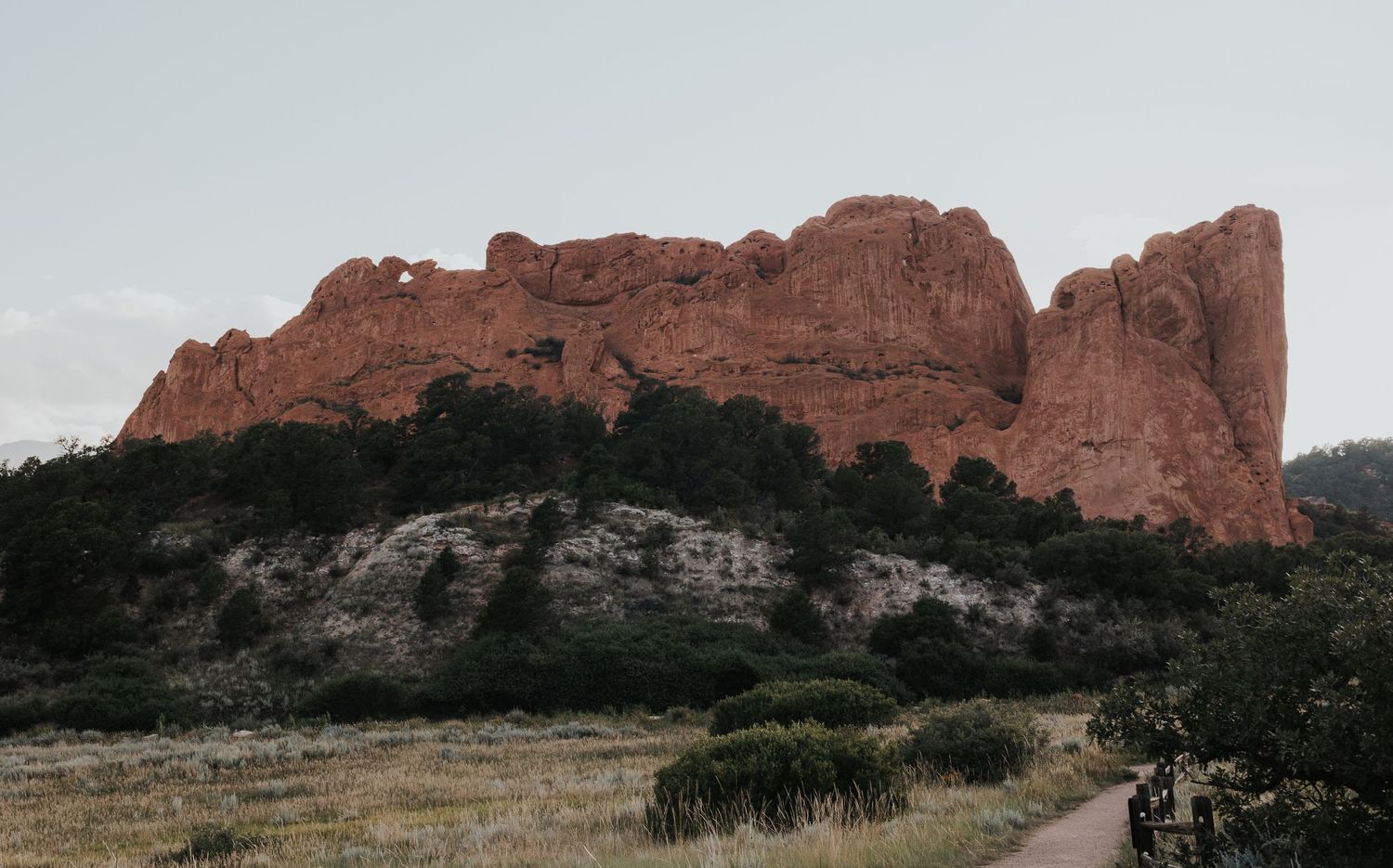 A series of scenic panoramic views of red rock formations and desert landscapes at Garden of the Gods in Colorado.