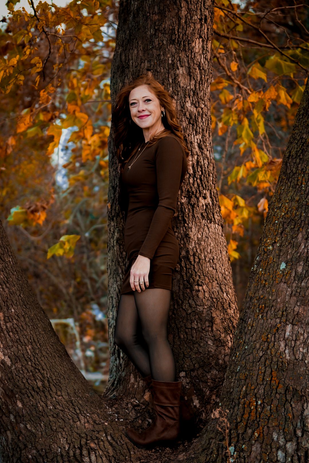 Portrait series of a woman in a brown dress posing against autumn trees with golden leaves.