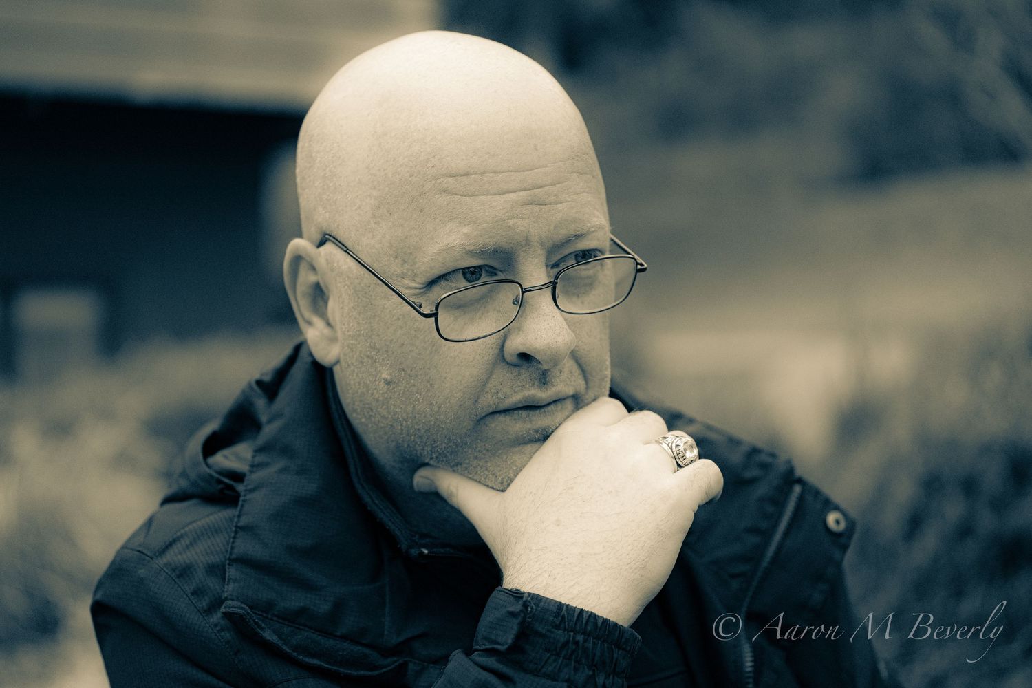 Black and white portrait series showing contemplative expressions and gestures.