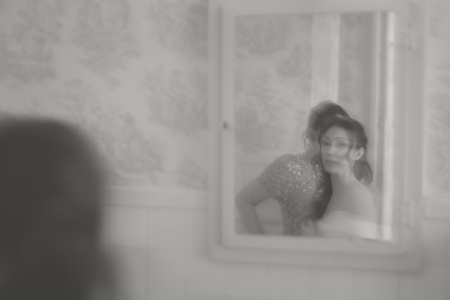 bride looking in the mirror