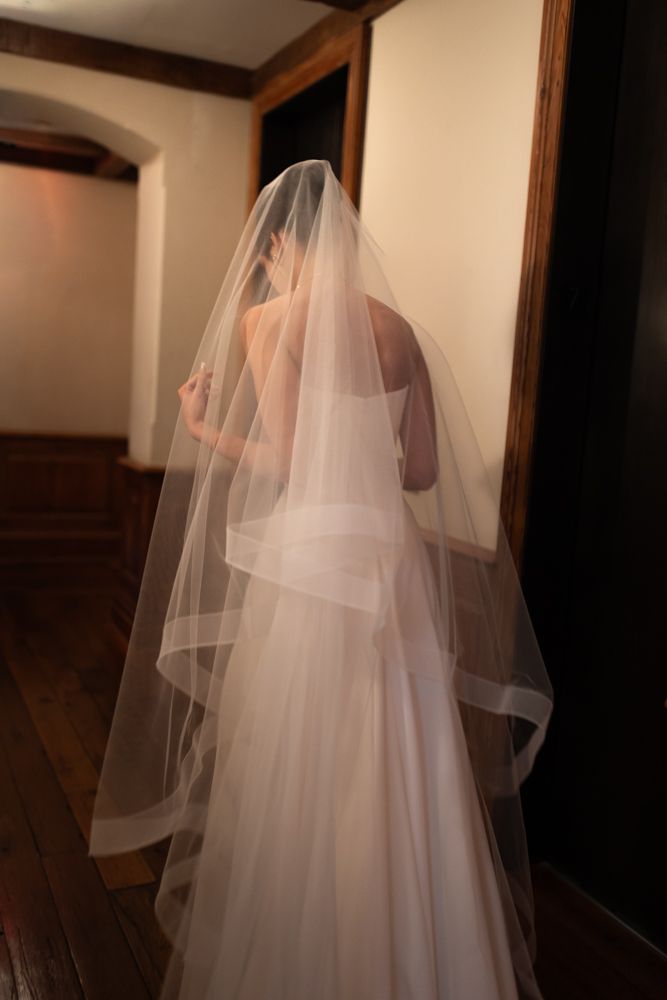 bride with veil in hallway