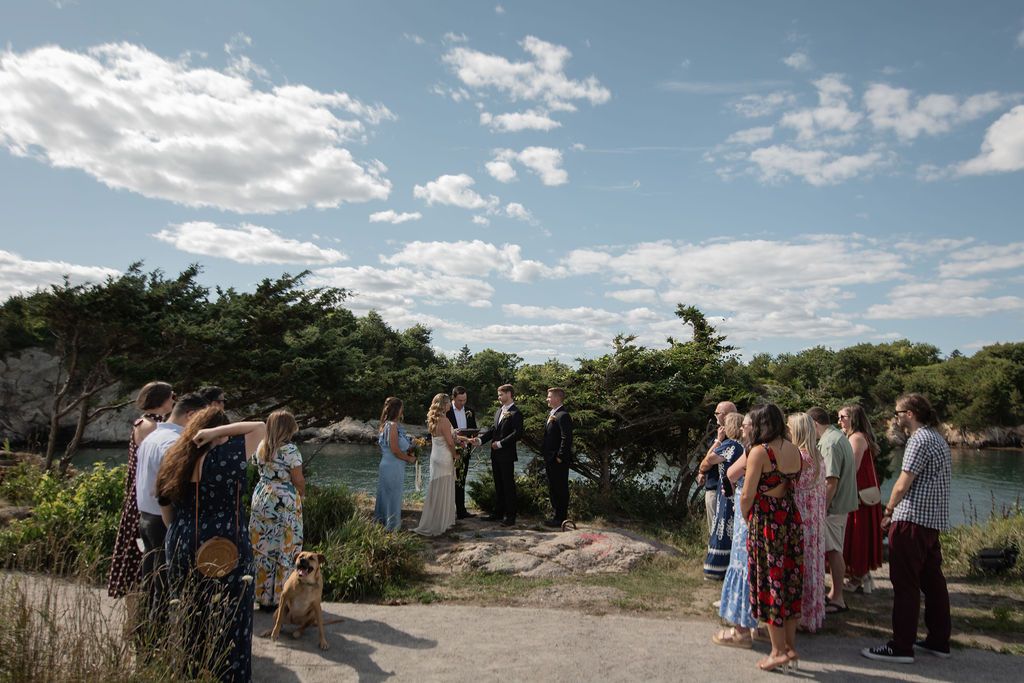 small intimate wedding ceremony on the rocks overlooking the bay