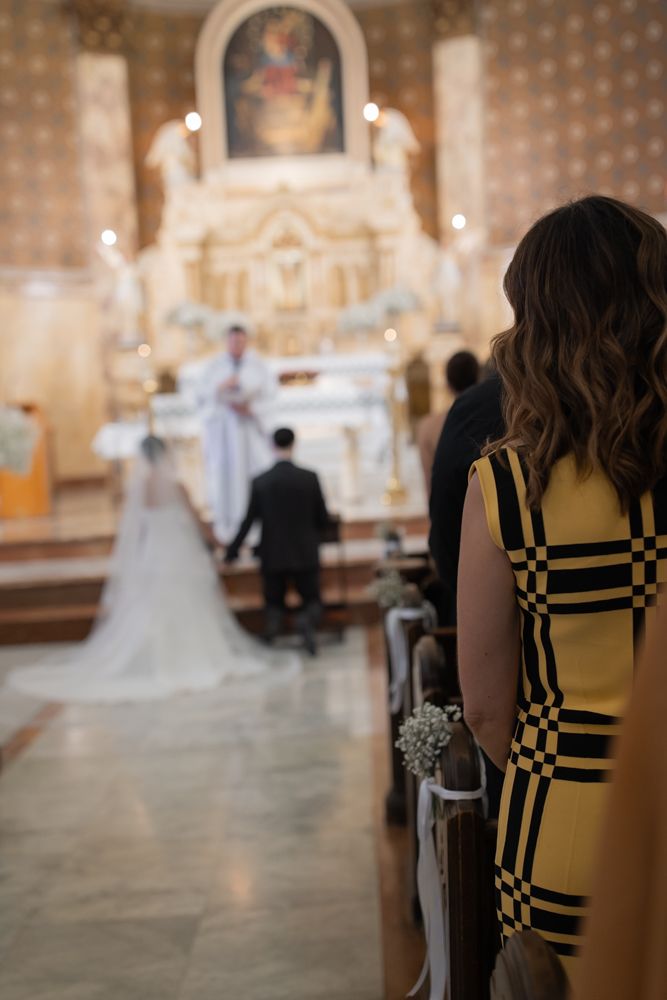 bride and groom holding hands at church wedding