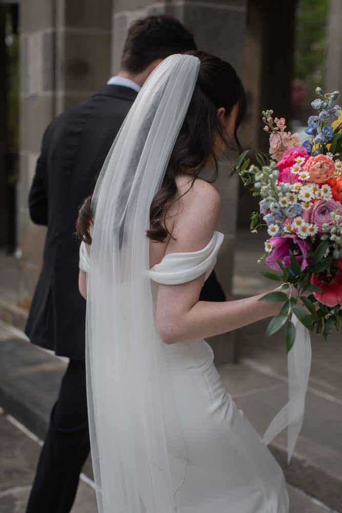 bride and groom walking indoors together