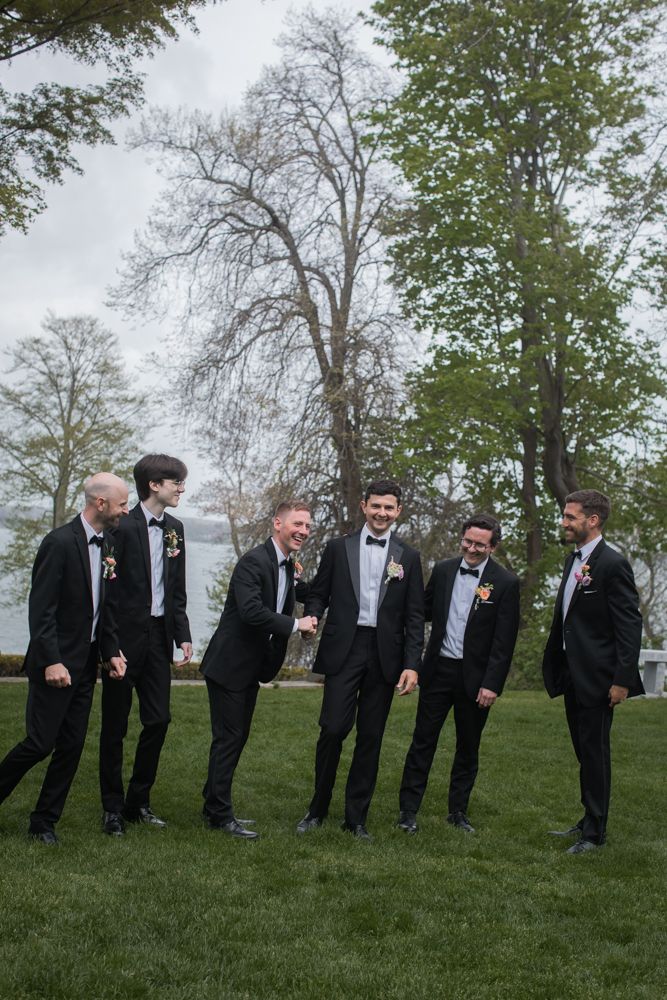 groomsmen laughing together