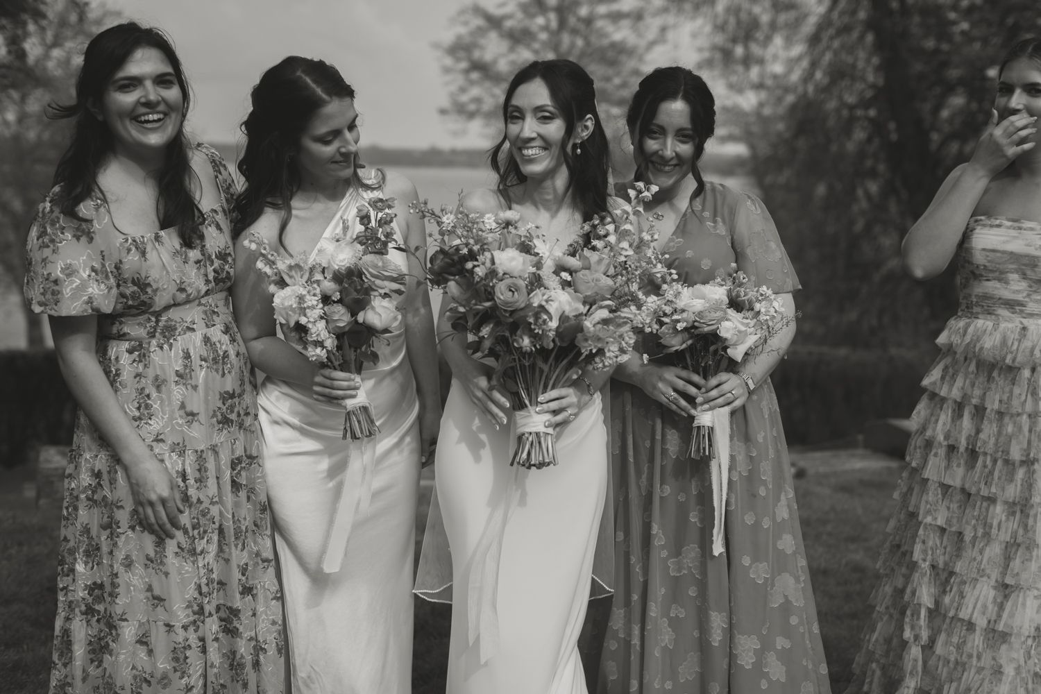 black and white photo of bride with bridesmaids