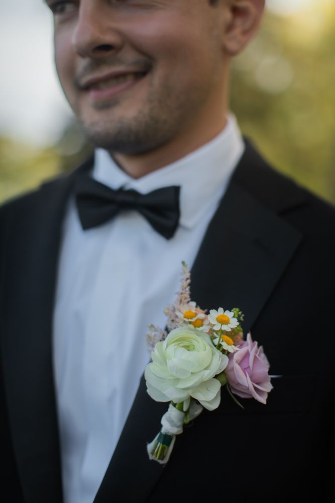 groom smiling with bow tie