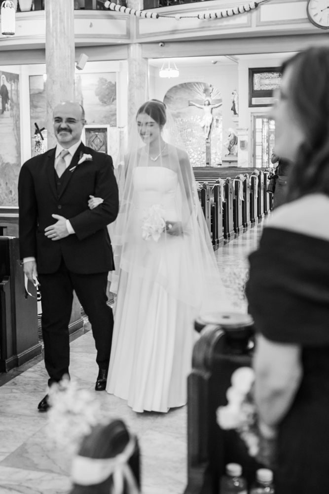 bride and father walking down the aisle