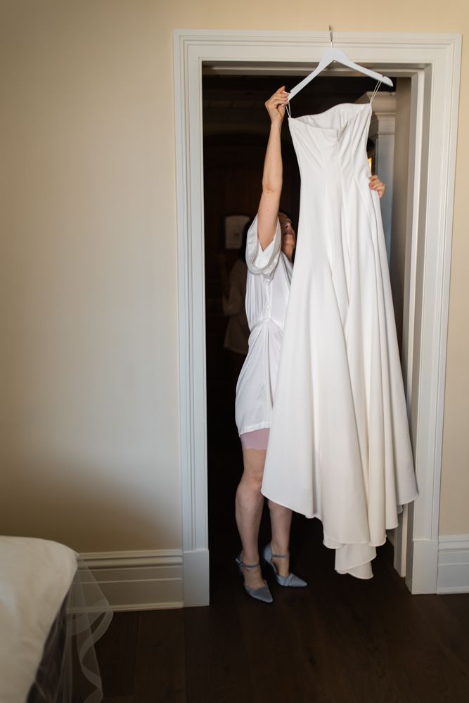 mother of the bride hanging up dress