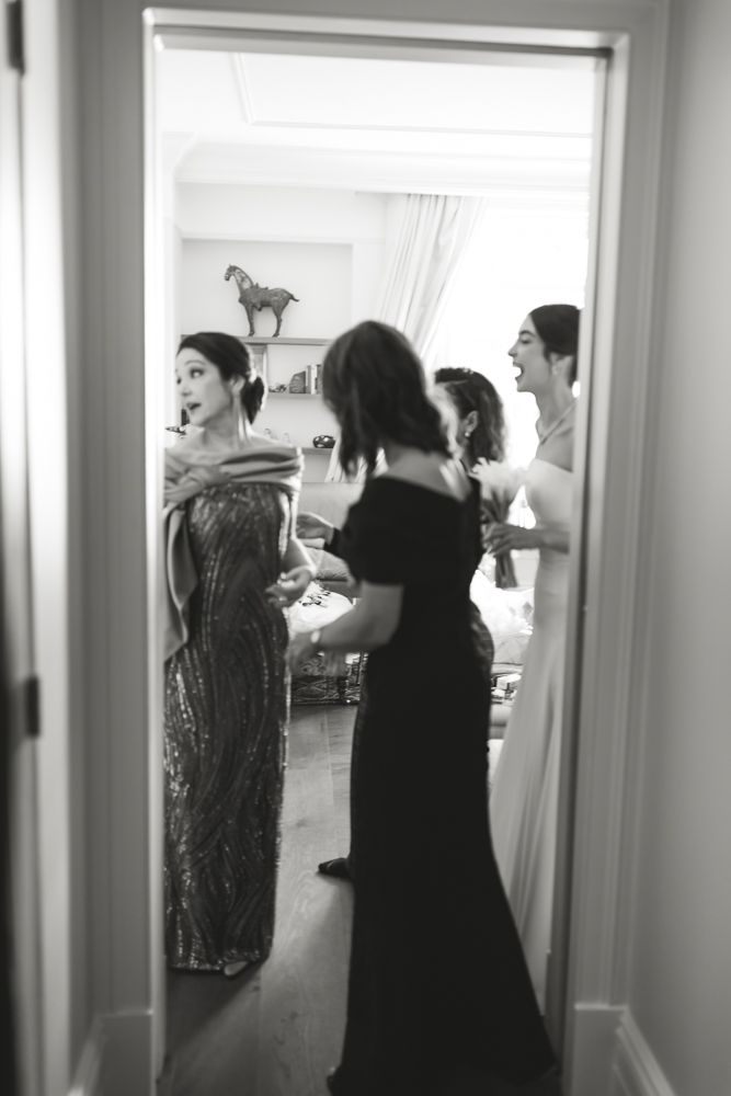 mother of the bride trying on dress