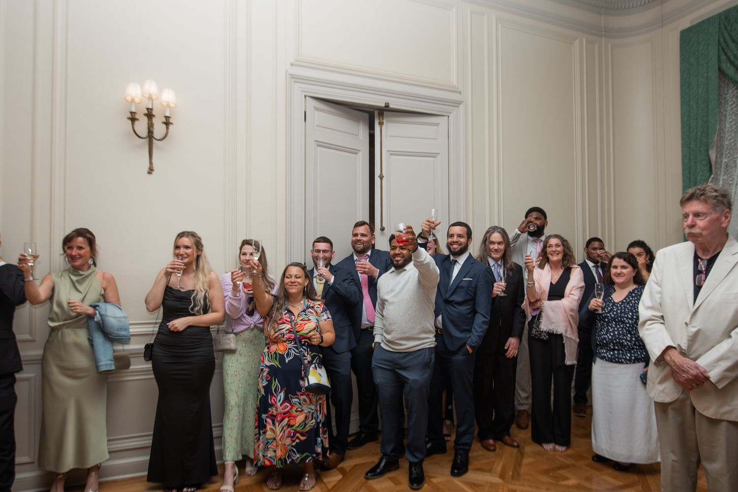 wedding guests gathered in ballroom at reception