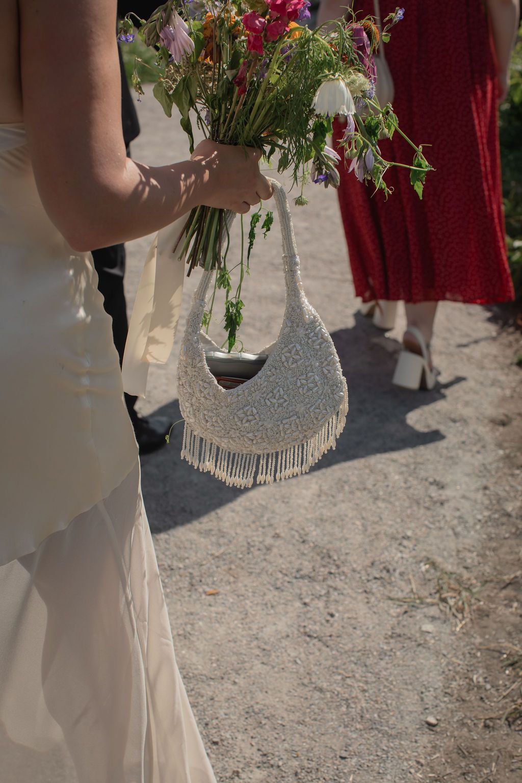 white beaded wedding purse and bouquet