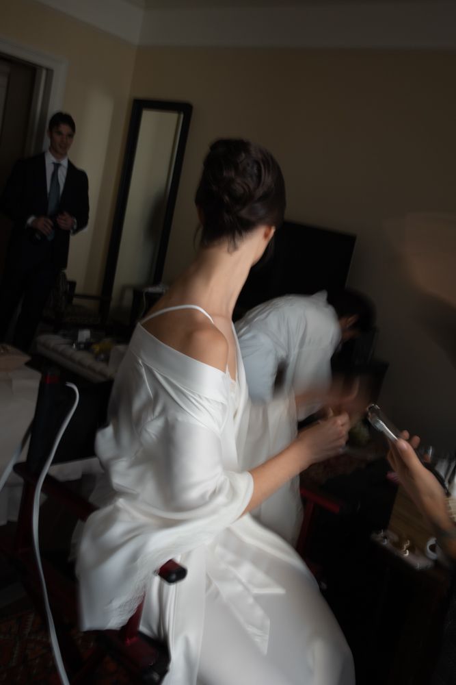 artistic photo of bride getting ready