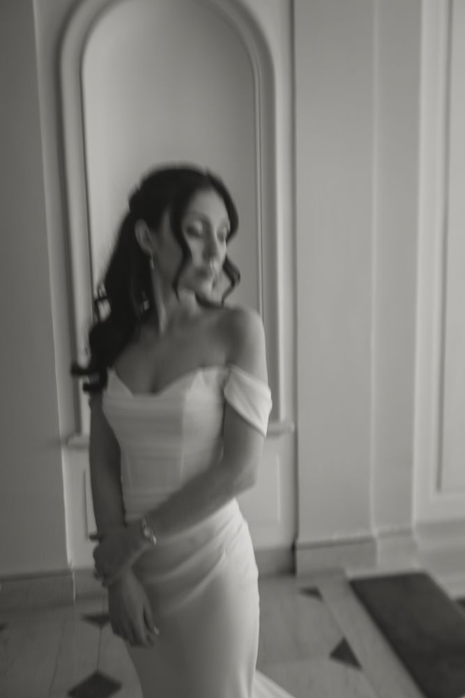 portrait of bride in front of arched doorway