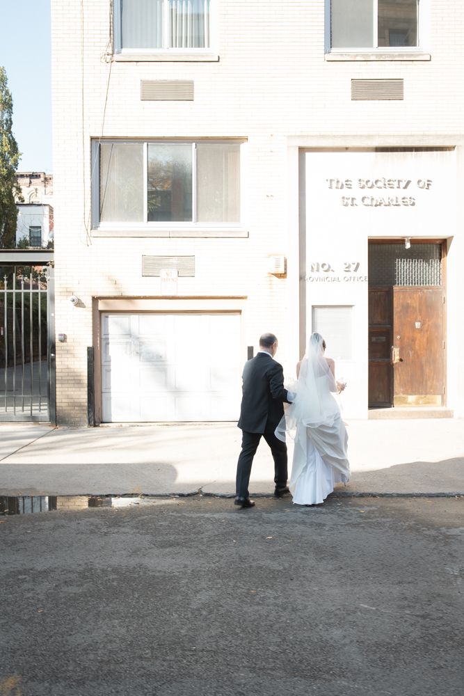 photo of bride and her father crossing the street