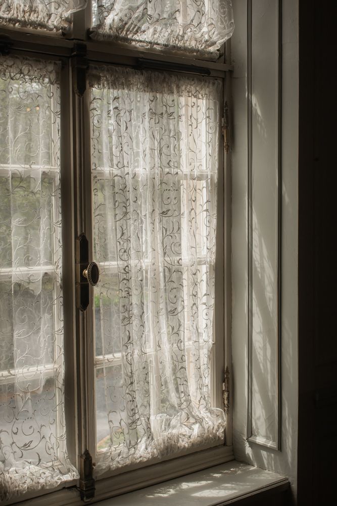 lace curtains over a window at glen manor house