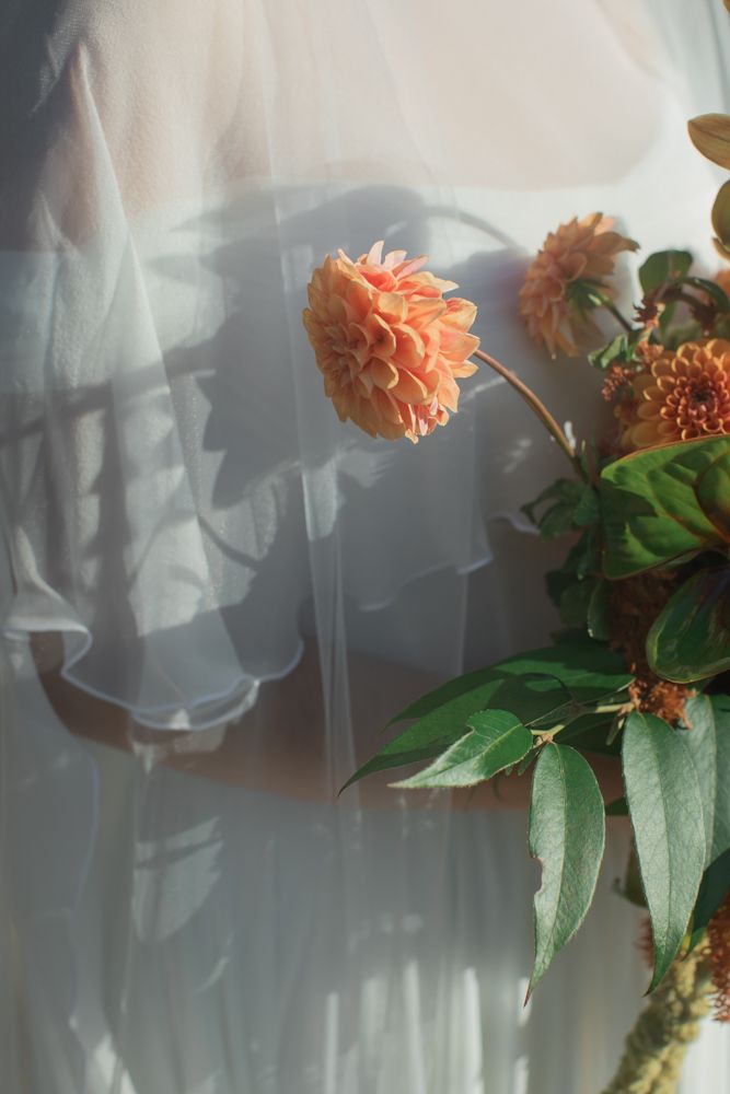 flowing wedding gown with organic bouquet
