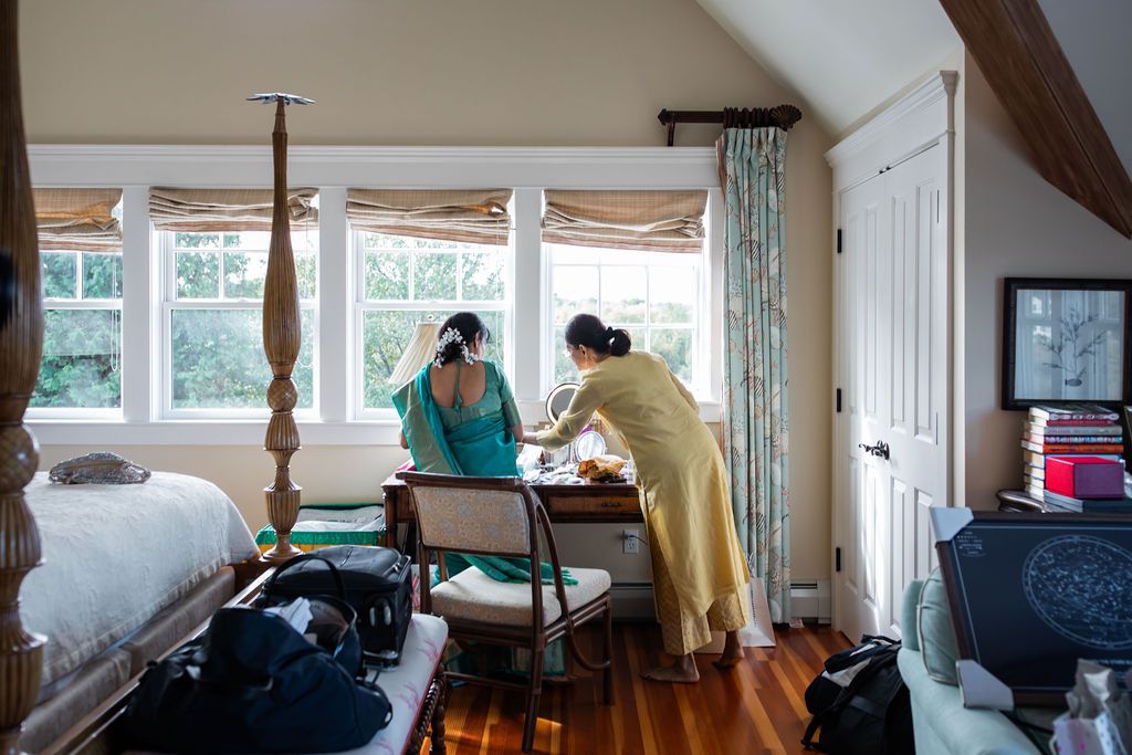 documentary style photo of woman getting ready for indian wedding ceremony