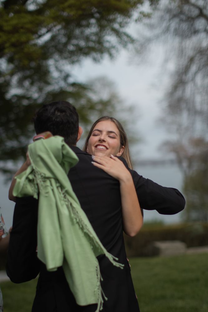 groom hugging guests at glen manor house portsmouth, rhode island