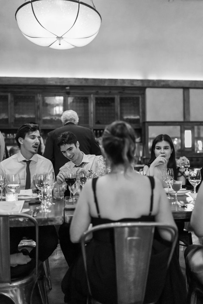 wedding guests laughing at dinner