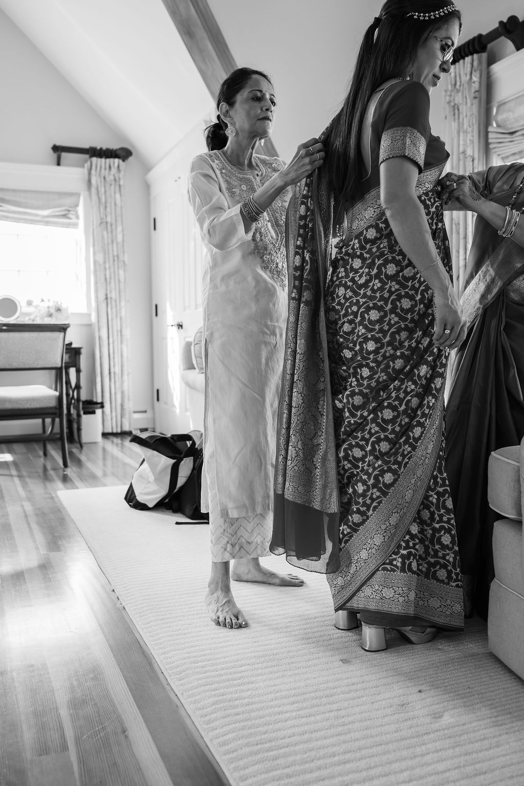 black and white photo of woman getting ready for indian wedding ceremony