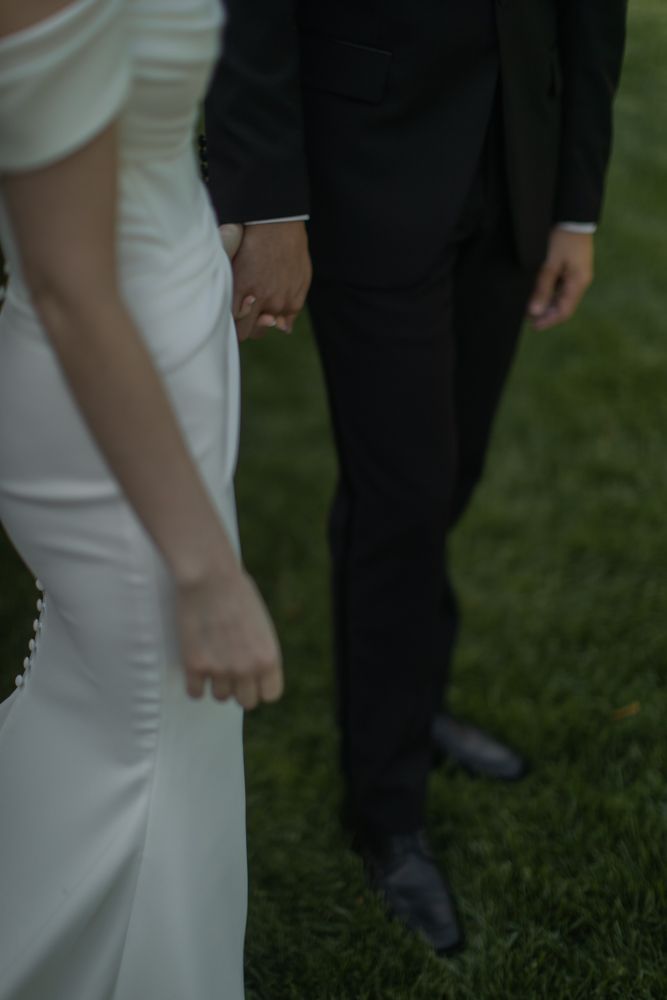 photo of bride and groom holding hands