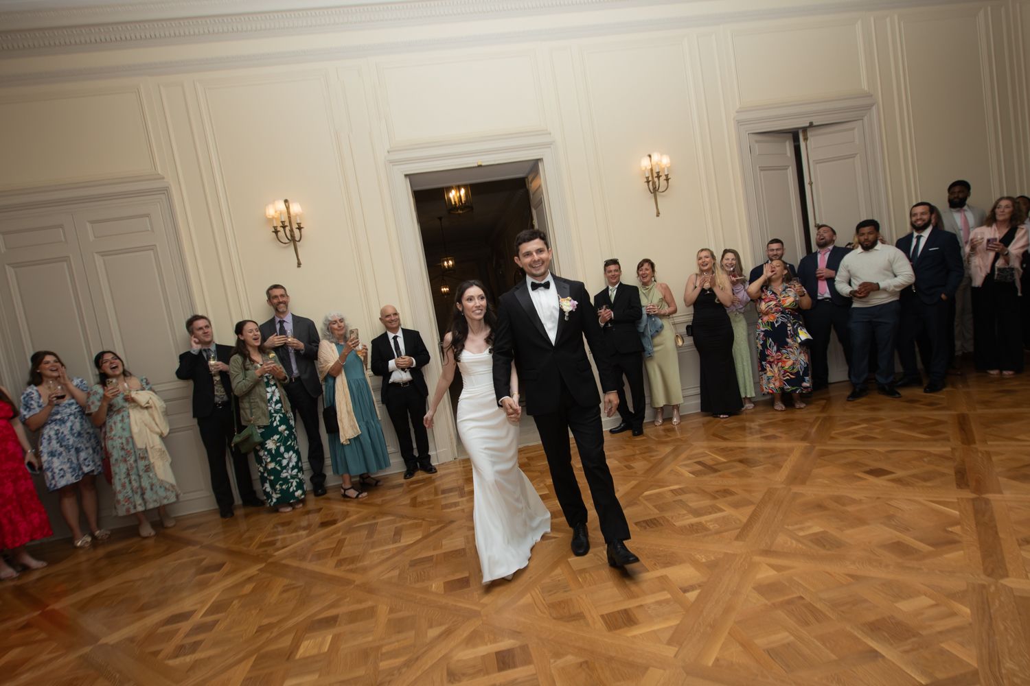 bride and groom entering reception