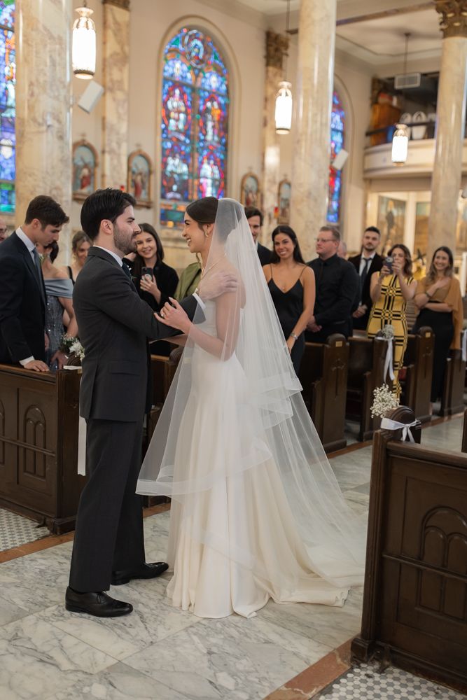 groom greeting bride at church wedding