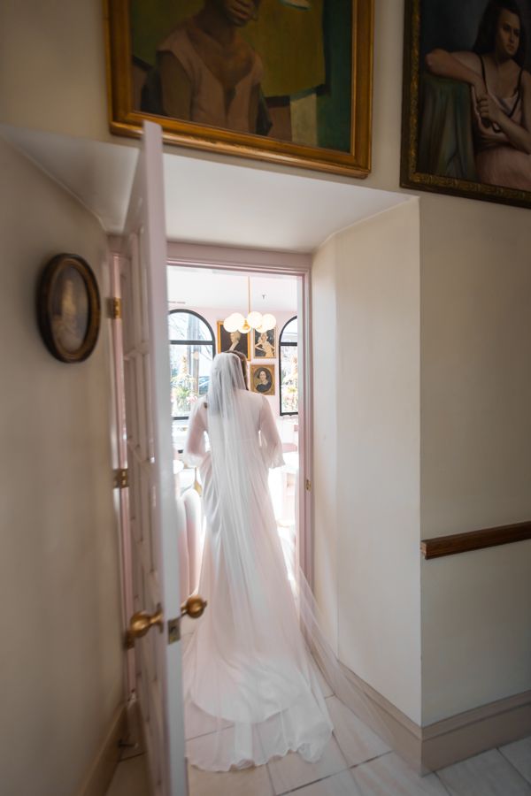 candid bride entering doorway boston ma
