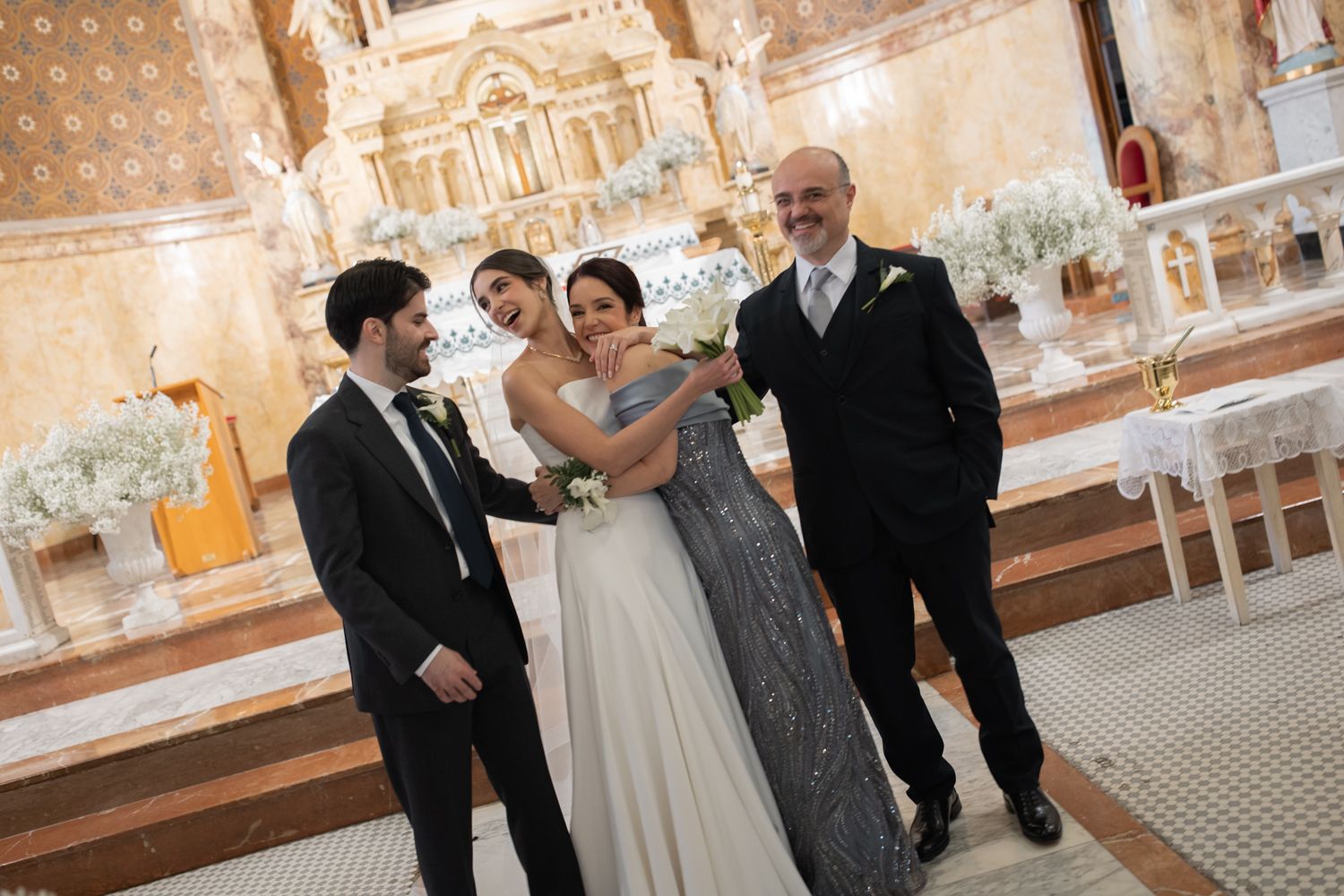 bride hugging family at church
