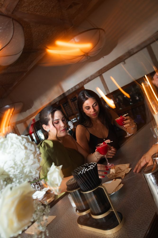 wedding guests getting drink at the bar