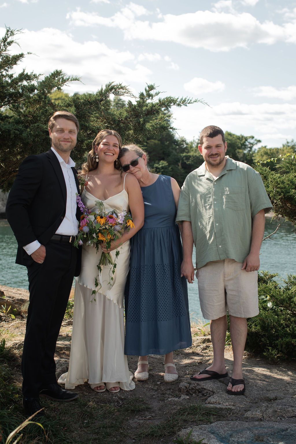 family portrait at outdoor wedding ceremony