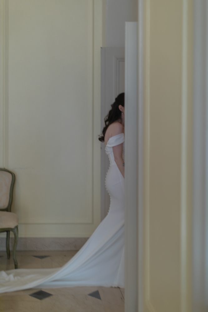 bride walking through a doorway