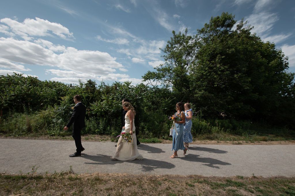 guests walking to outdoor wedding ceremony